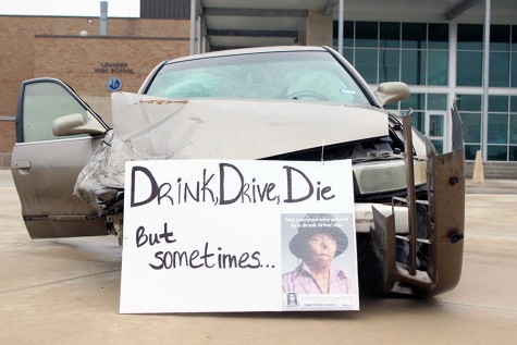 At the front of the car it says "Drink, Drive, Die". It also features a victim of drunk driving on the side of the sign.