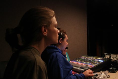 Assistant Director Brooke Wetuski and sophomore manager Crimson Scott in the sound booth during the final late rehearsal before Mirage. “I helped write a lot of Coach Anderson’s script,” Scott said. “I had to make sure I know who’s music goes to who and to make sure I got everything right for each specific night.”
