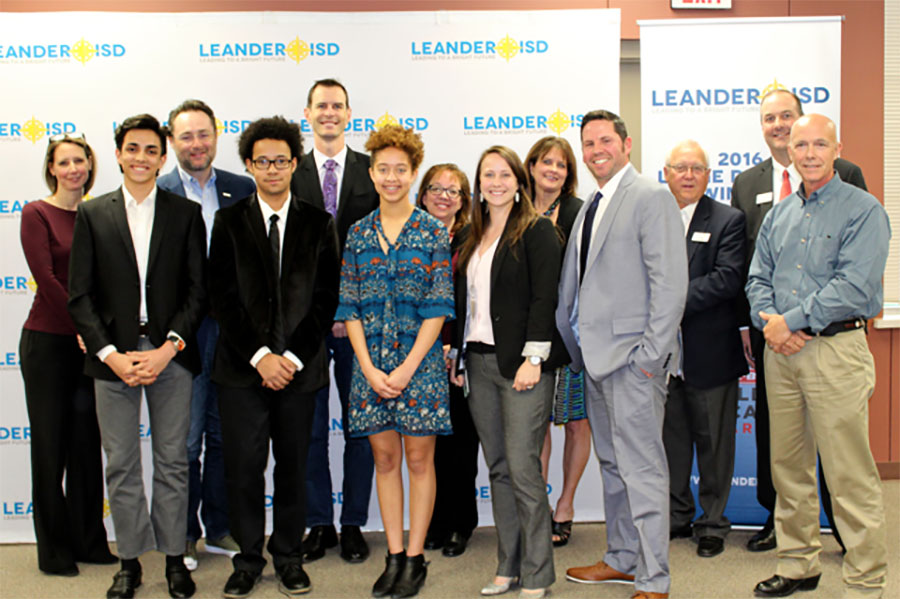 Some of the members of the Youth and Government team stand for a photo at the board meeting. Senior Jared Bouloy was selected to go to nationals.
