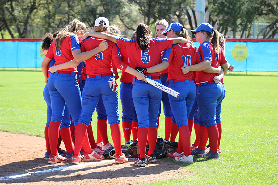 The varsity team huddles up before their game against Hays. They are now going into off season.