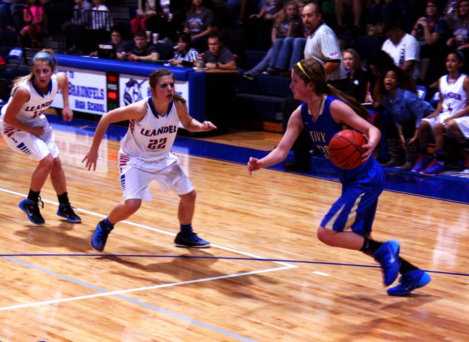 Junior Mariah Springer plays defense against a Lady Antlers player.