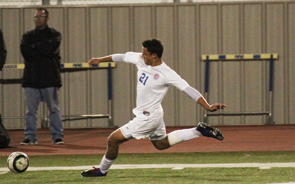 Junior Christian Vieira aims to kick to a fellow teammate in an attempt to make a goal in the second half of the Vandegrift game.