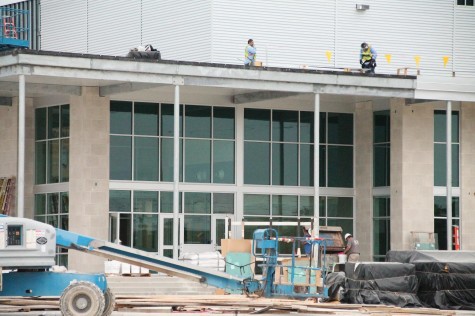 Construction workers finishing the new science building.