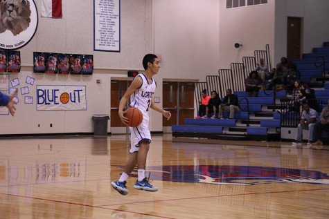 Freshman Ruben Luna preparing to dribble down to the basket