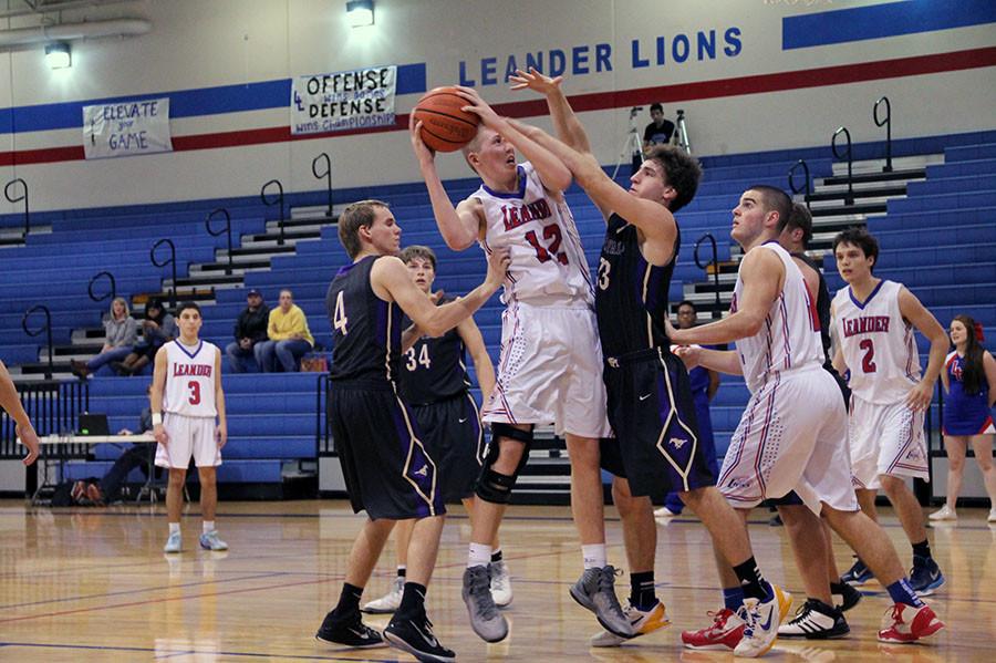 Sophomore Chase Cotton goes for a layup against Marble Falls