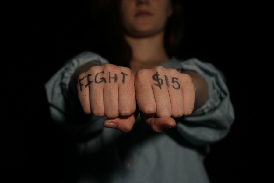 Fight for 15 written on a pair of fist ready to fight