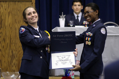 Maynard presents an award to sophomore Erykah Owens-Taylor at Change of Command.