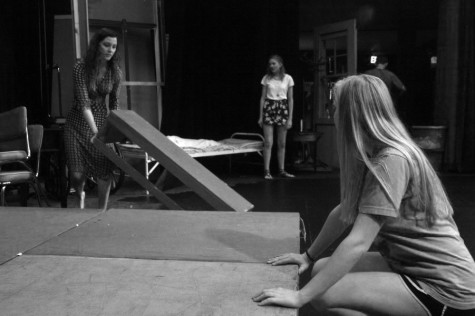 Senior-directors Alli Lesko(right) and Courtney Castillo(left) working on their set for 'Rabbit Hole."