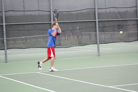A Lions player hitting the tennis ball back to the opposing side. The Lions would later lose 15-4.