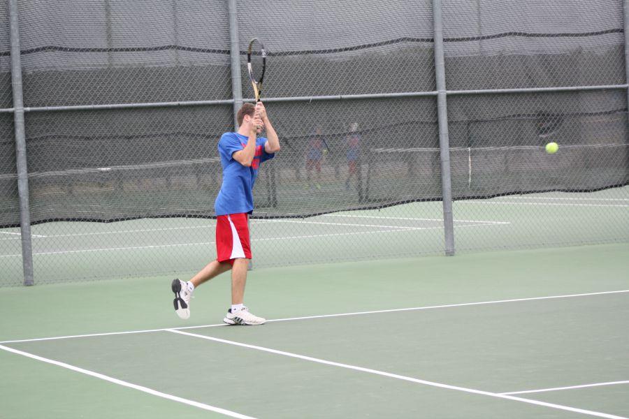 A Lions player hitting the tennis ball back to the opposing side. The Lions would later lose 15-4.