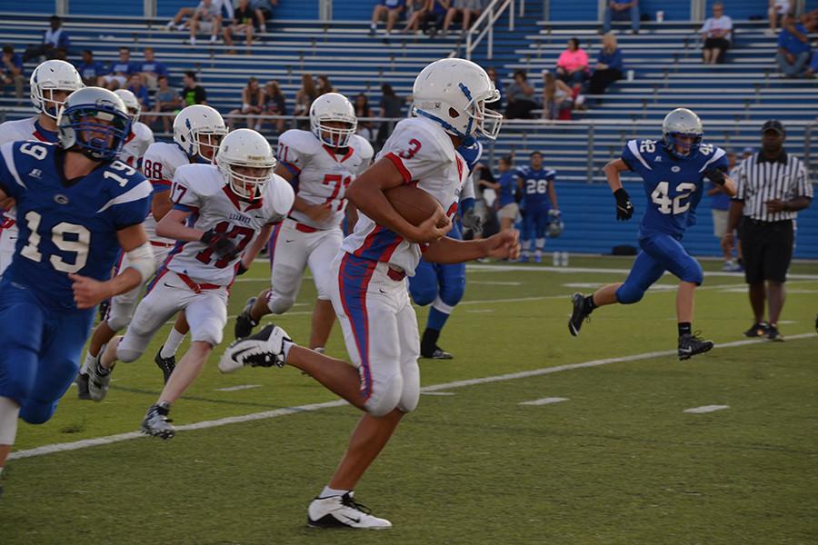 Sophomore Lukas Boeck runs for a touchdown. Boeck’s touchdown was the only points the Lions scored during the Red team game.