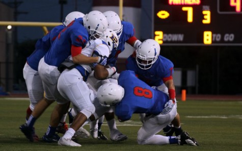 The Lions defense tackling a Pflugerville player. The defense would get six turnovers during the game.