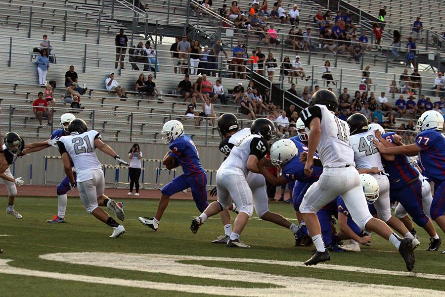 Running back sophomore Lukas Boeck runs in for a touchdown. The touchdown put the Lions ahead for the first time of the night. 