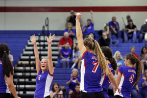  Senior Callie Reed throws her fist up after scoring in her games. The Lady Lions  won all of their sets, sweeping the Lady Mustangs.