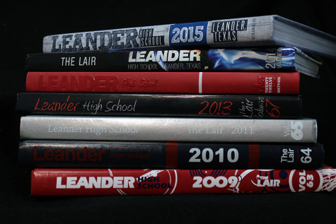 The Lair’s yearbooks from 2009 until 2015. Over the years the size of the books have grown.  