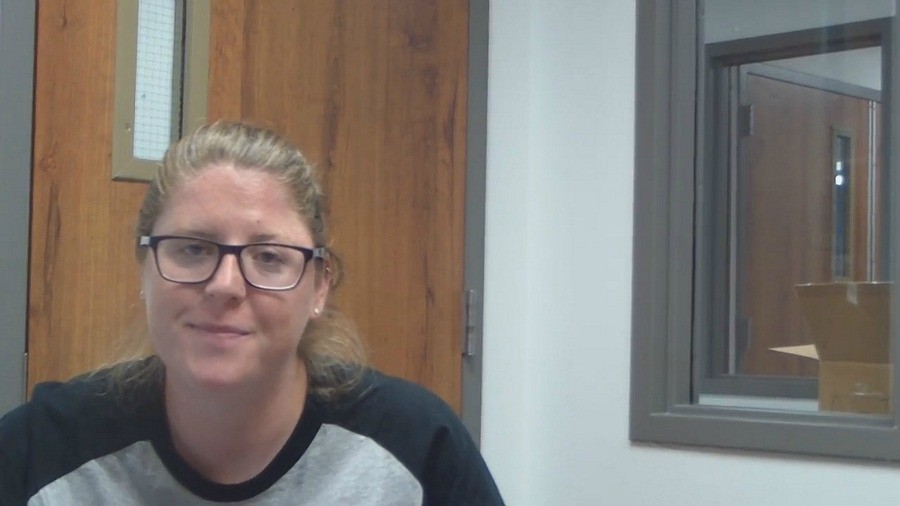 Band director Ali Carver in the band hall as the band practices. Mrs. Carver in the past has studied abroad.