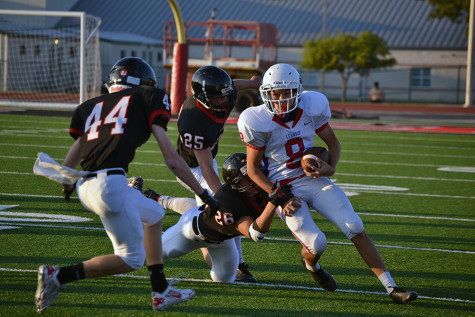 Sophomore quarterback Josh Rude running the ball. Rude finished the season with 5 rushing touchdowns.