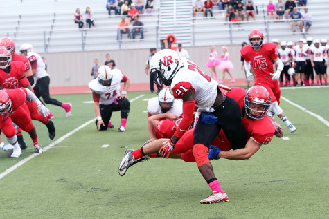 Senior Matthew Long tackling a Vista Ridge runner. The Lions defense forced two fumbles in the game.