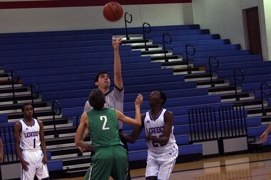 Junior Kevone Graham during the tip-off of the game. He turned out successful in directing the ball to his side.