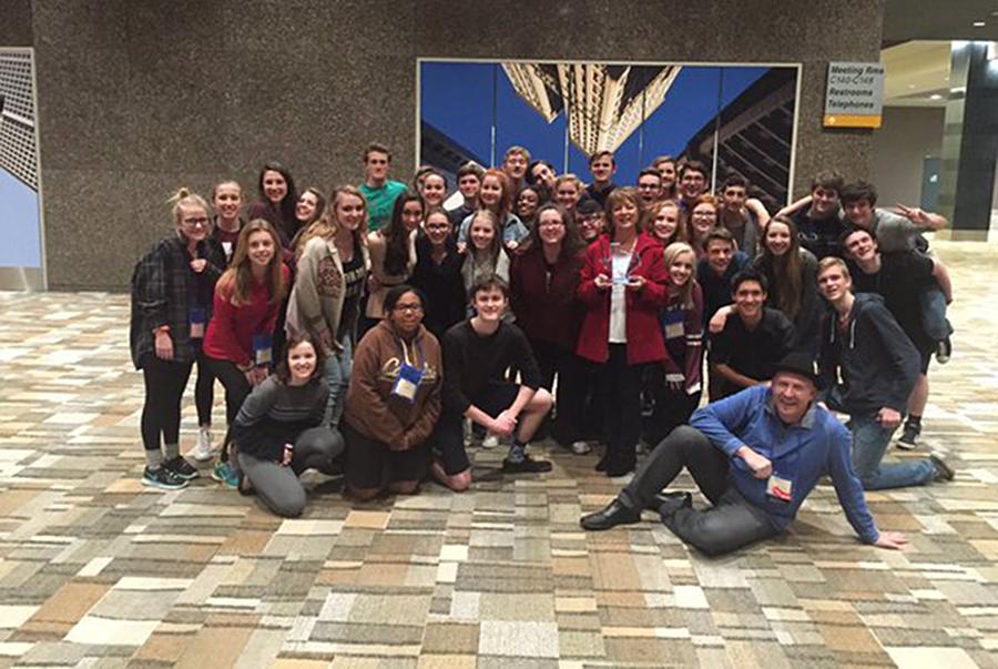 Troupe 5232 at the end of convention. Linda Major is standing in the middle of the crowd and holding her award for being inducted into the Thespian Hall of Fame.
