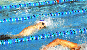 Student swims free style. All that is left in the season is districts, regions, and state.