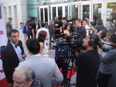 Actors on the red carpet being interviewed.