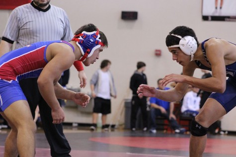 Junior Ricky Smith wrestling at Vista Ridge. Smith placed 2nd in the tournament. 
