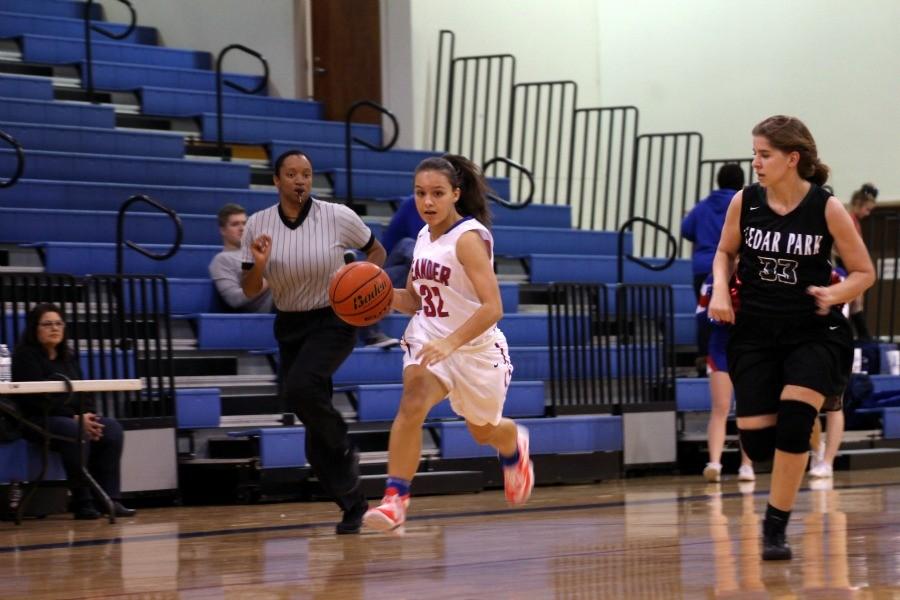 Junior Mikaela Noe dribbling down the court against Cedar Park. The Lady Lions scored a total of 33 points in the third and fourth quarters.