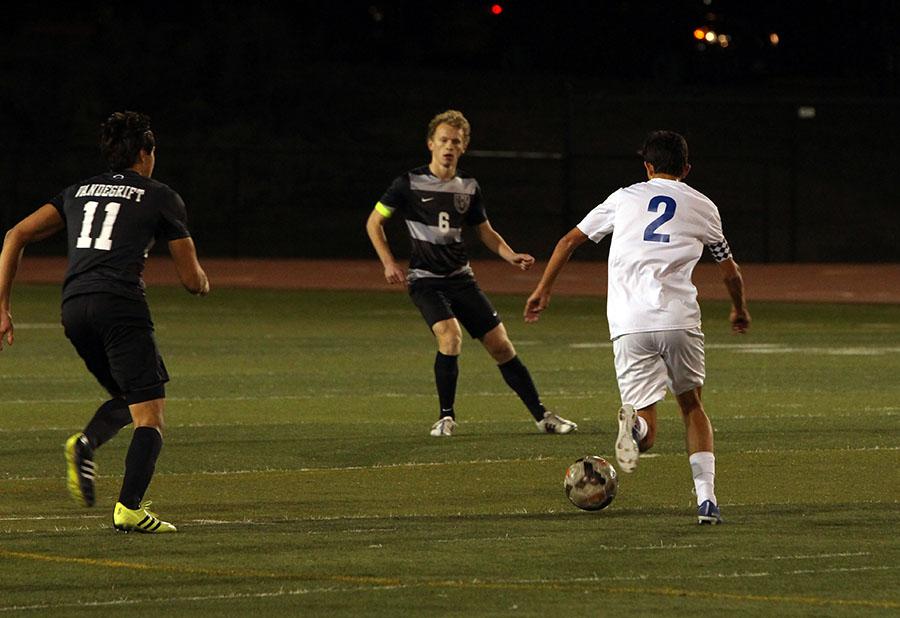 Senior captain Dallas Sullivan attacks the Vandegrift defense. Sullivan is a forward but was unable to beat the Vandegrift defense in this game.