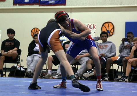 Freshman John Geiger wrestles his Hutto opponent. He won this match and later became the runner up State Champion.