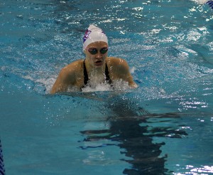 Student swims at a university pool.  After state the swim team ranked 15th.