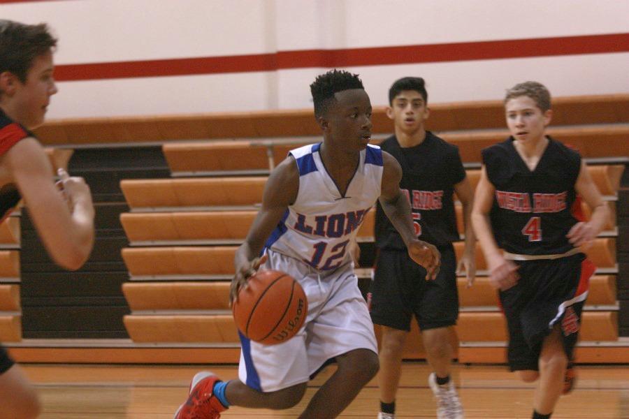 B-team player Destin Pinkey running through the Rangers to score for the Lions. The game against Vista Ridge was their second time facing the team.