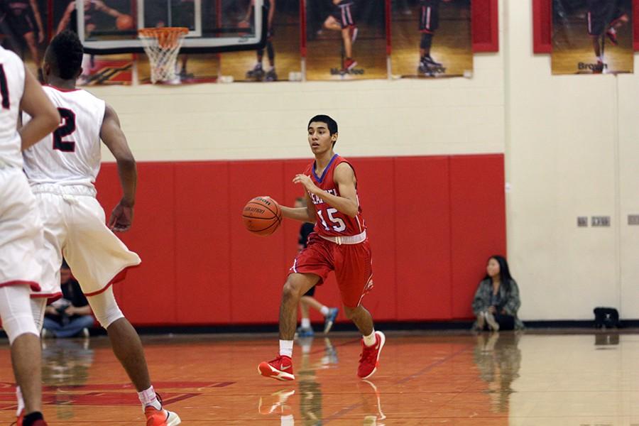 Sophomore Ruben Luna dribbling down the court against Vista Ridge. The Lions play Dripping Springs next for senior night.