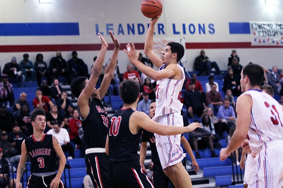 Junior Kobe Thompson shooting for the basket against Vista Ridge. The Lions will play against the Rangers this Friday.