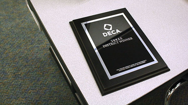 A plaque won by a DECA member. Multiples will be engraved and left in Ms. Groomes' classroom.