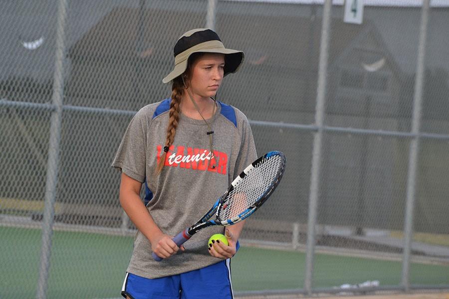 Senior Madison Flesner preparing to serve against Rouse during the fall season. The Lions would lose to Killeen overall 3-7.