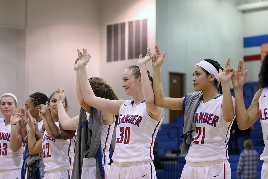 All of the girls' basketball teams lined up after the game for the school song. Varsity has already clinched the playoffs and will begin their playoff run next week.