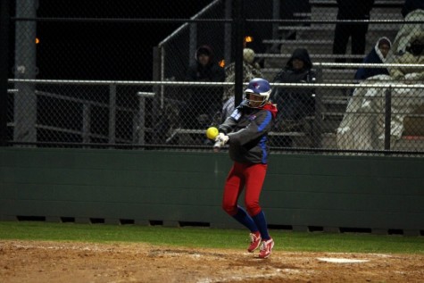 Senior Gabby Walton hitting the ball against Rouse. Waltons bunt, and senior Hailey MacKays hit helped start a comeback in the seventh inning that led to the Lady Lions win.