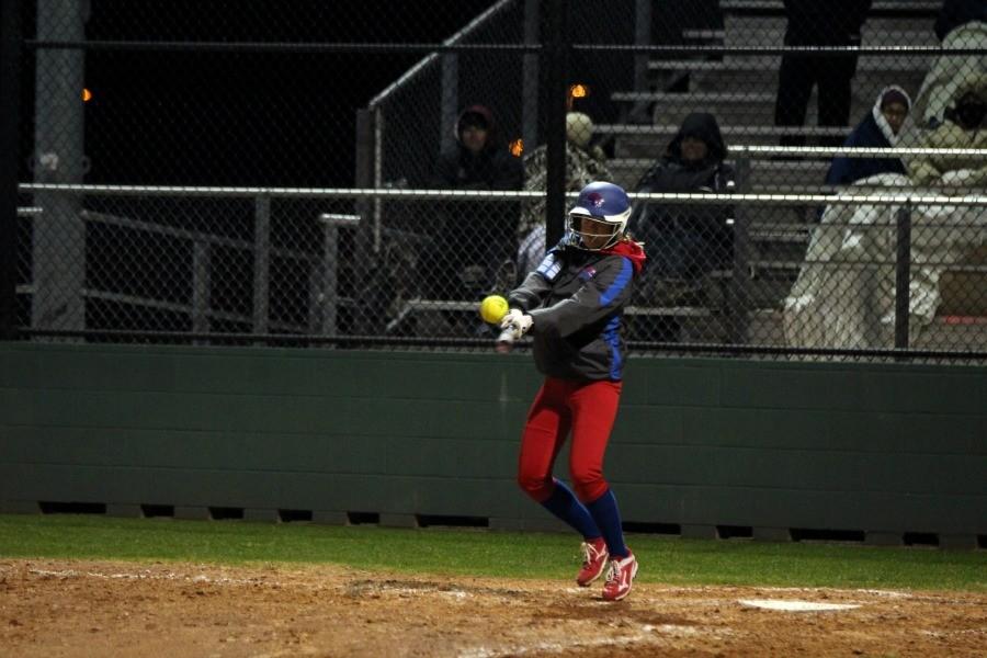 Senior Gabby Walton hitting the ball against Rouse. Waltons bunt, and senior Hailey MacKays hit helped start a comeback in the seventh inning that led to the Lady Lions win.