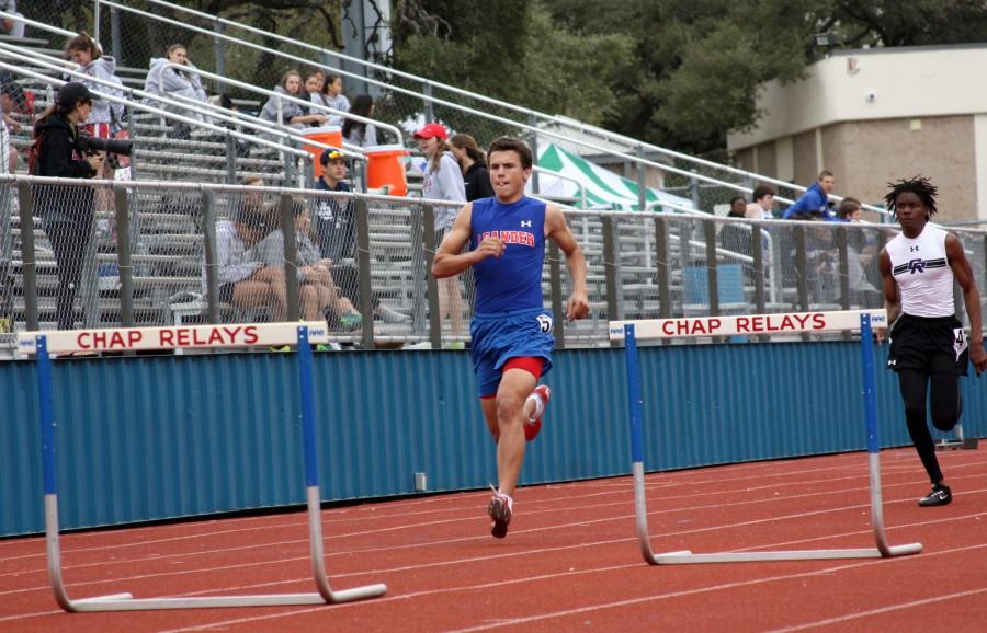 Sophomore Lukas Boeck running hurdles. The whole team practices outside at Bible Stadium. 
