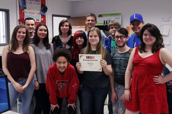 The entire newspaper staff after receiving their SNO Distinguished Site award. The newspaper has also been nominated for an ILPC Star for the current year.