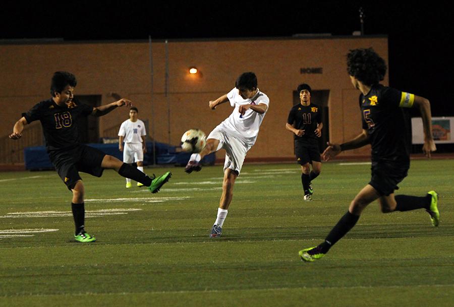 Senior Dallas Sullivan shoots the ball towards goal. He finished his last goal with a hat trick.