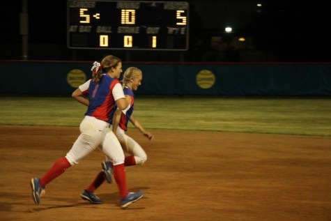 Current seniors Hailey MacKay and Gabby Walton celebrating after an overtime win last year, The Lady Lions run and jump after every game.