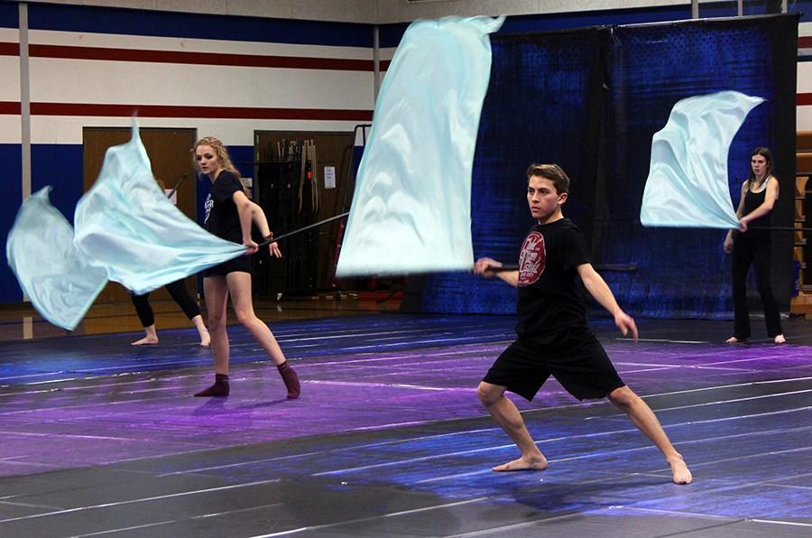 The Winter Guard practices their routines. Winter Guard is individual performances while Color Guard is with band in the fall.