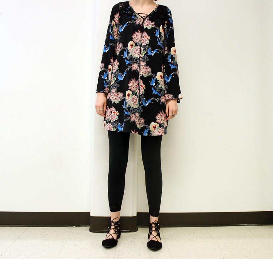 Student wears a floral dress with leggings and lace-up pointed shoes. They shoes can be found at Target.