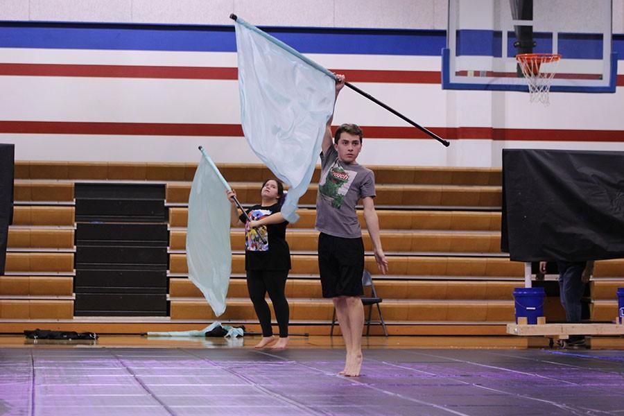 The winter guard practices their performance. They practice in the Leander gyms. 