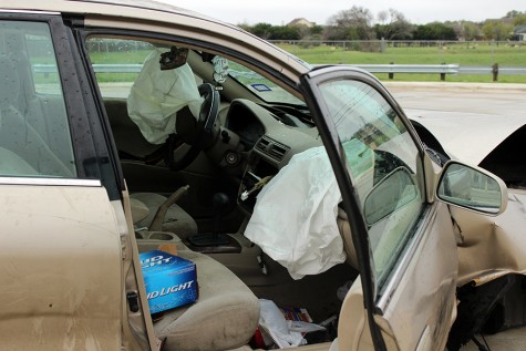 The inside of the car shows deflated airbags, and an empty beer box. The driver, took the last beer with him after the crash.