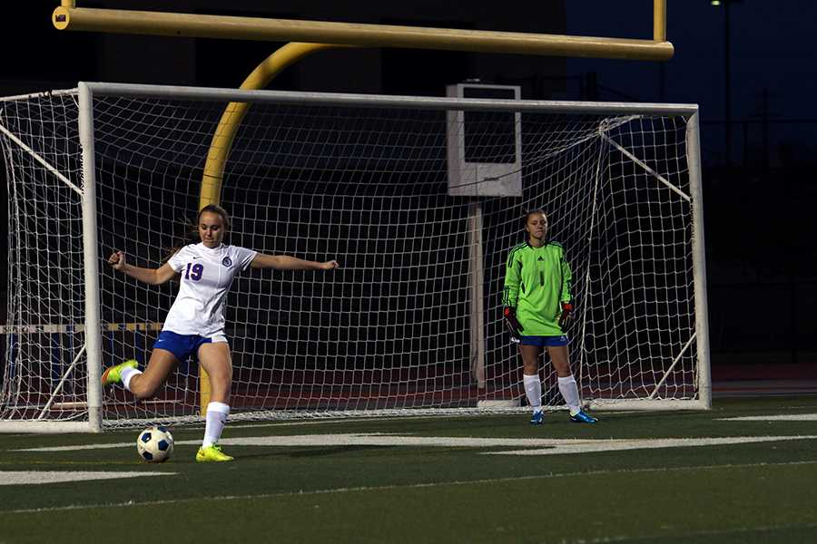 A JV girls' soccer player kicking the ball against Georgetown. The game resulted in a 0-0 tie.