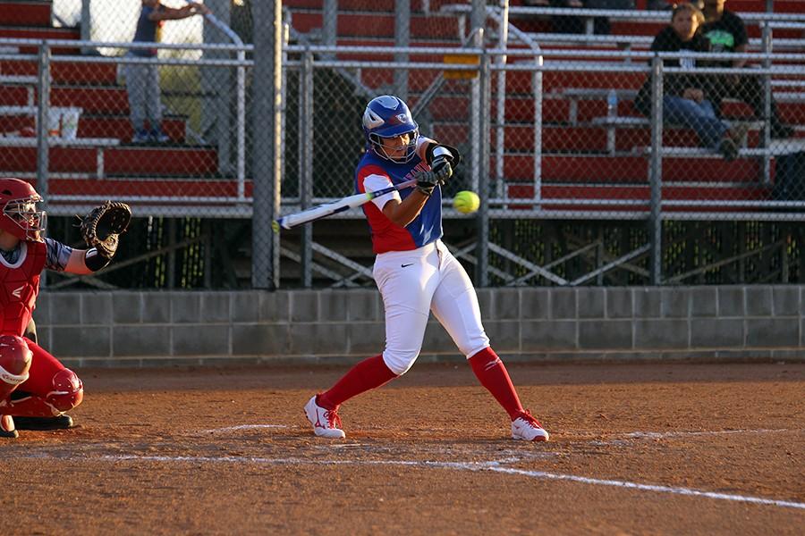 Senior Hailey MacKay hitting a double in the first inning.  Two doubles were hit in the game, one game by MacKay, and one hit by Haley Henderson.