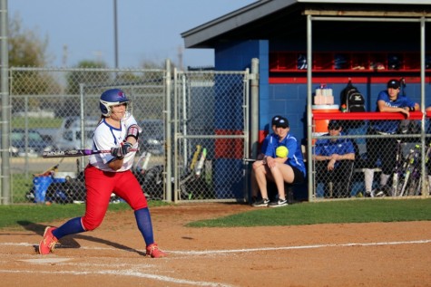Senior Kellie Jeanes about to hit a ball. Jeanes had three hits and runs runs during the game. This included a double hit that resulted in two scores for the Lady Lions.